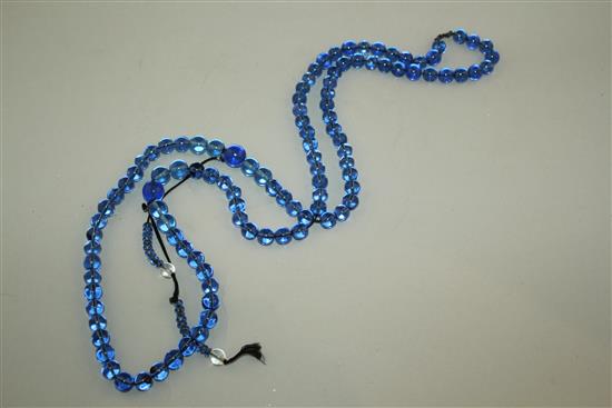 A Chinese blue glass bead Buddhist rosary, 65cm drop